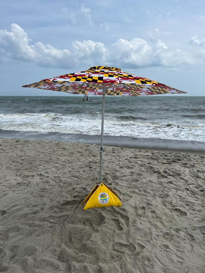 limited edition maryland flag beach umbrella set up at the beach