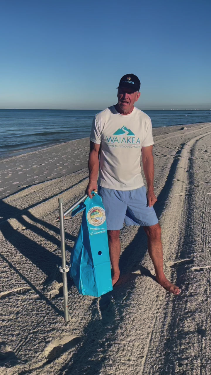 Load video: beachBUB ultra umbrella base being set up on a beach