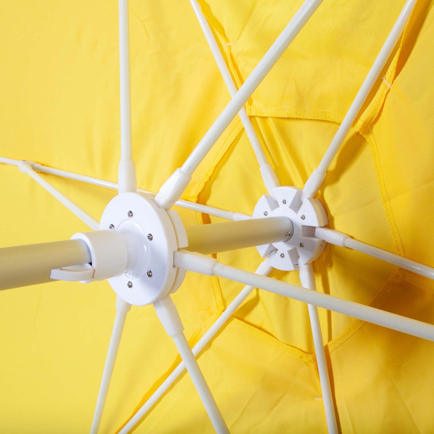 underside of yellow beach umbrella canopy