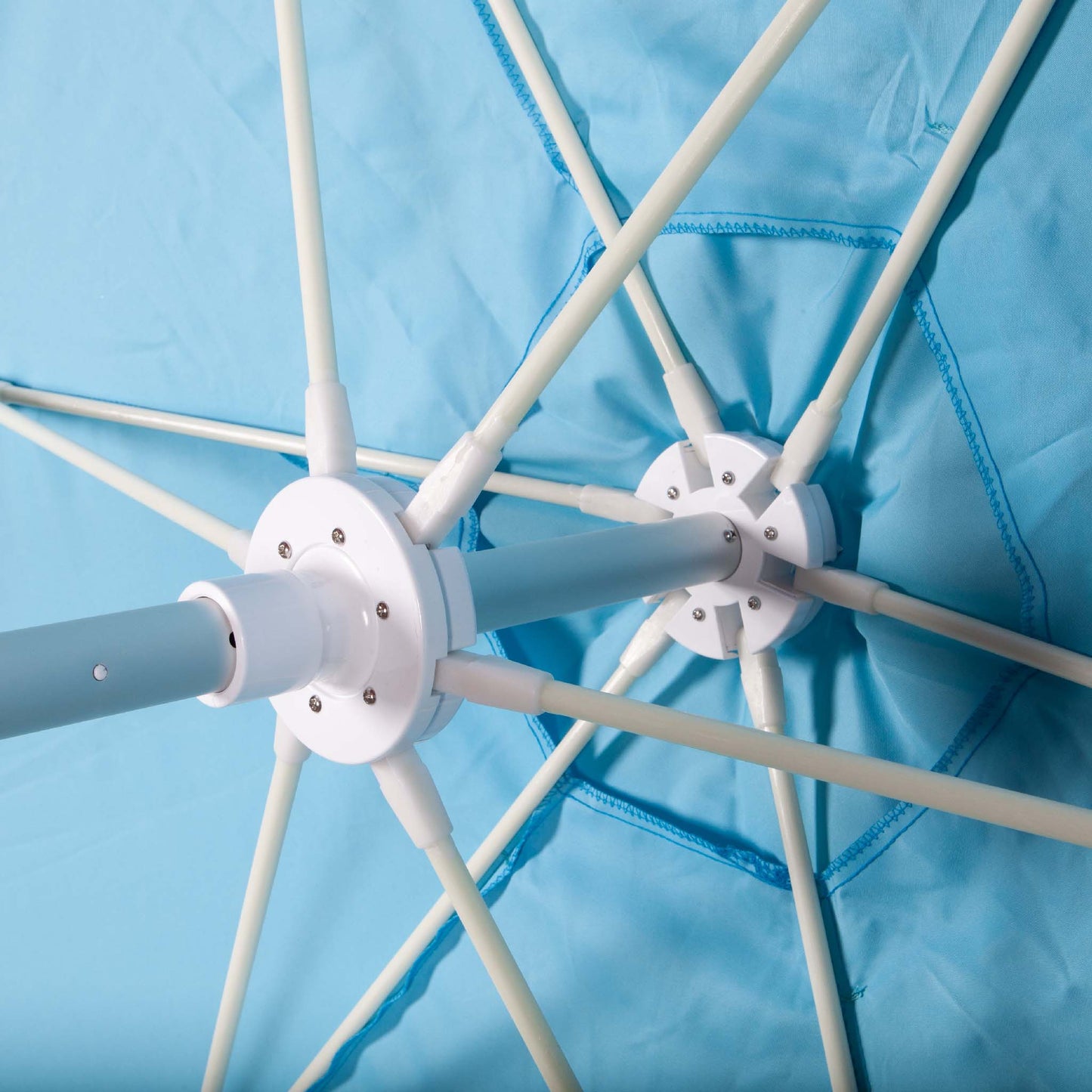 underside of blue beach umbrella canopy