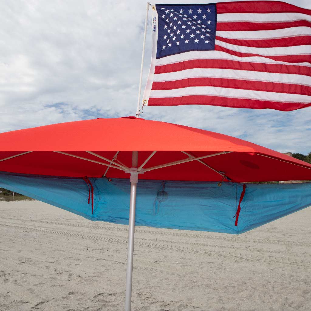 red beach umbrella with sun visor and american flag addons