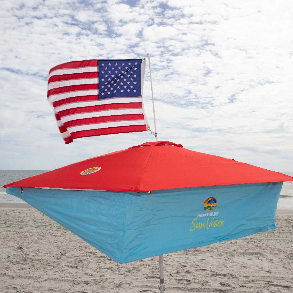 red beach umbrella with sun shade addon and american flag