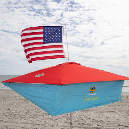 red beach umbrella with sun shade addon and american flag